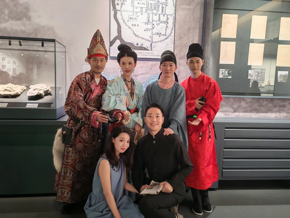 Roots with fellow volunteers during a museum cultural program