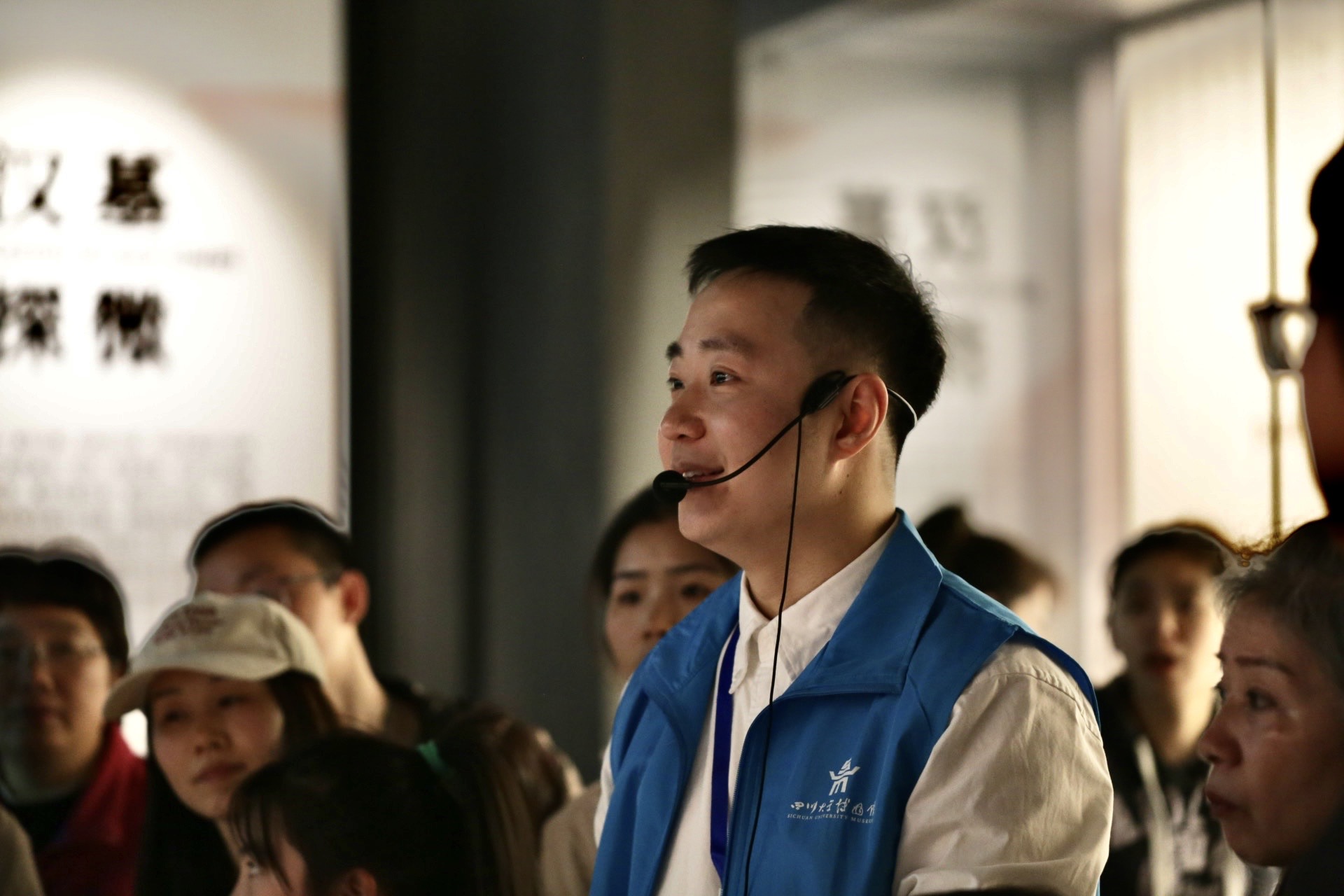 Roots Zhao sharing cultural stories as a volunteer museum guide